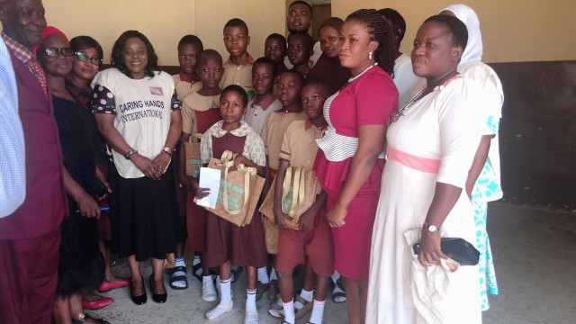 CHI-ED having a group photo section with ophanage students and teachers of Saint James Middle School, Ayetoro Osogbo.