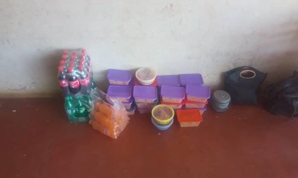 Packaged cooked food and drinks delivered to the ophernage by Caring Hands International